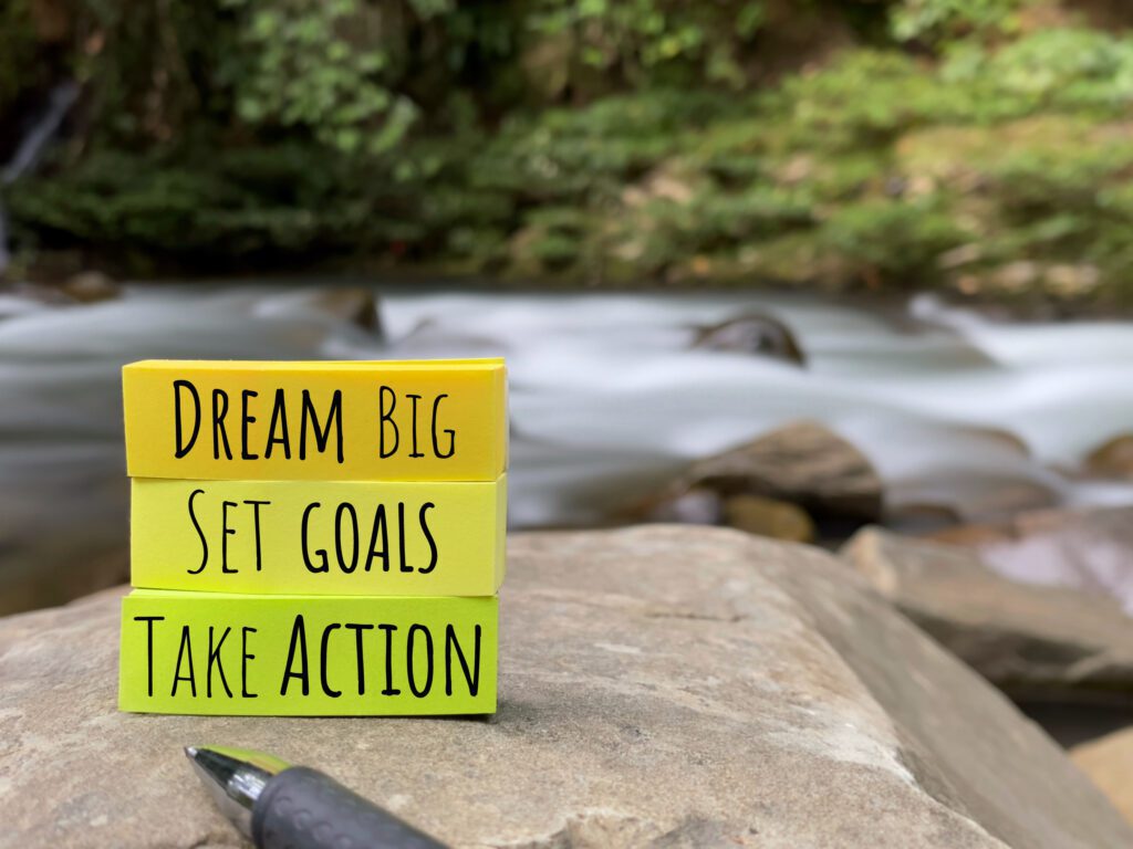 Motivation quotes written along with a river background